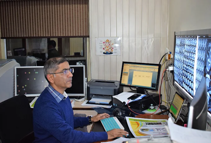 Sunrise Diagnostic Centre expert reviewing diagnostic scans